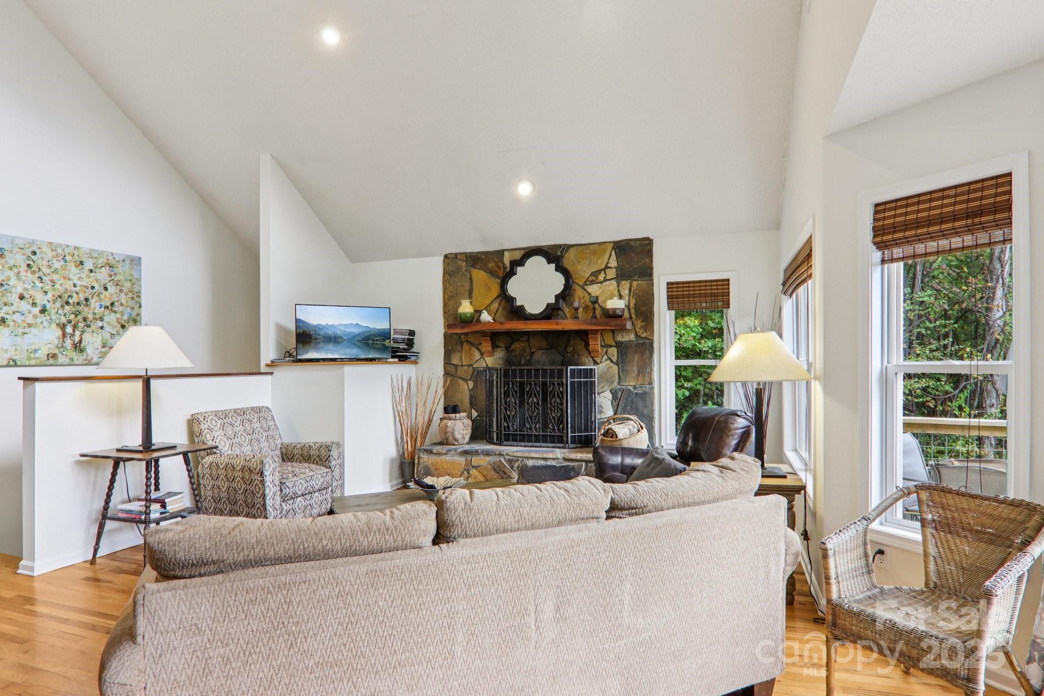 311 Jacks Knob Road Barnardsville, NC 28709 - Photo 14 of 48 a living room with furniture a fireplace and a large window