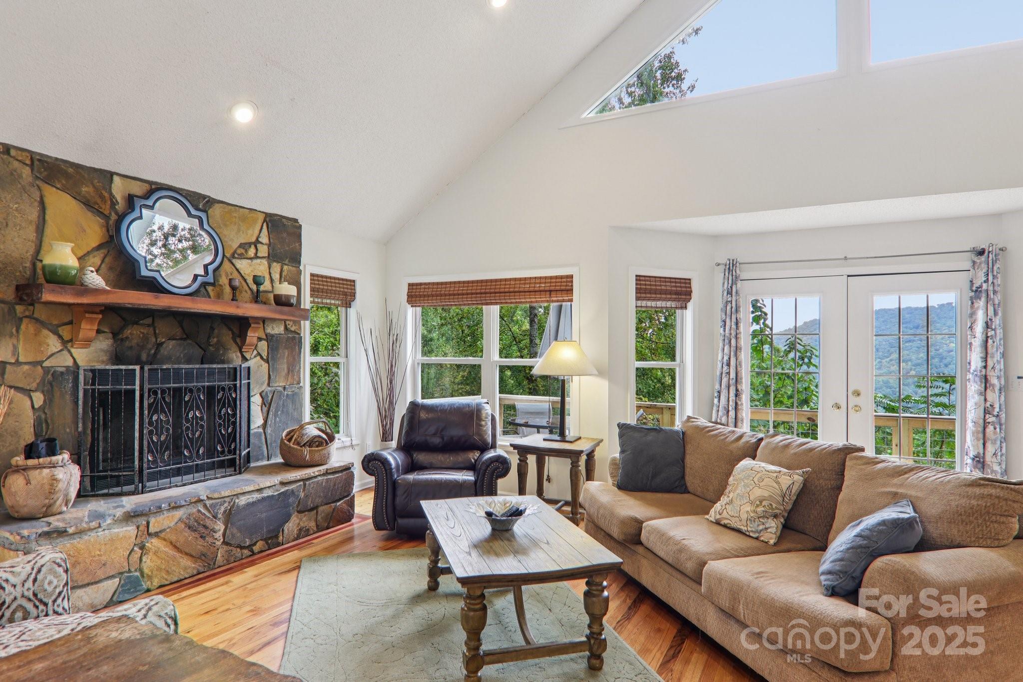 311 Jacks Knob Road Barnardsville, NC 28709 - Photo 15 of 48 a living room with furniture and a large window