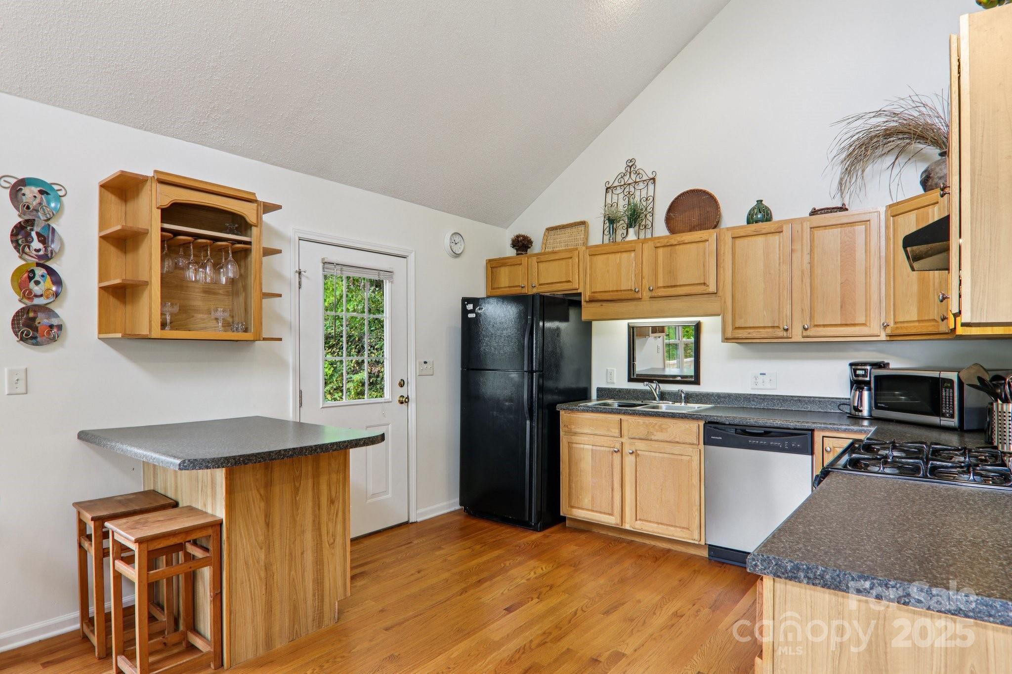 311 Jacks Knob Road Barnardsville, NC 28709 - Photo 27 of 48 a kitchen with stainless steel appliances granite countertop a refrigerator a stove top oven a sink and dishwasher