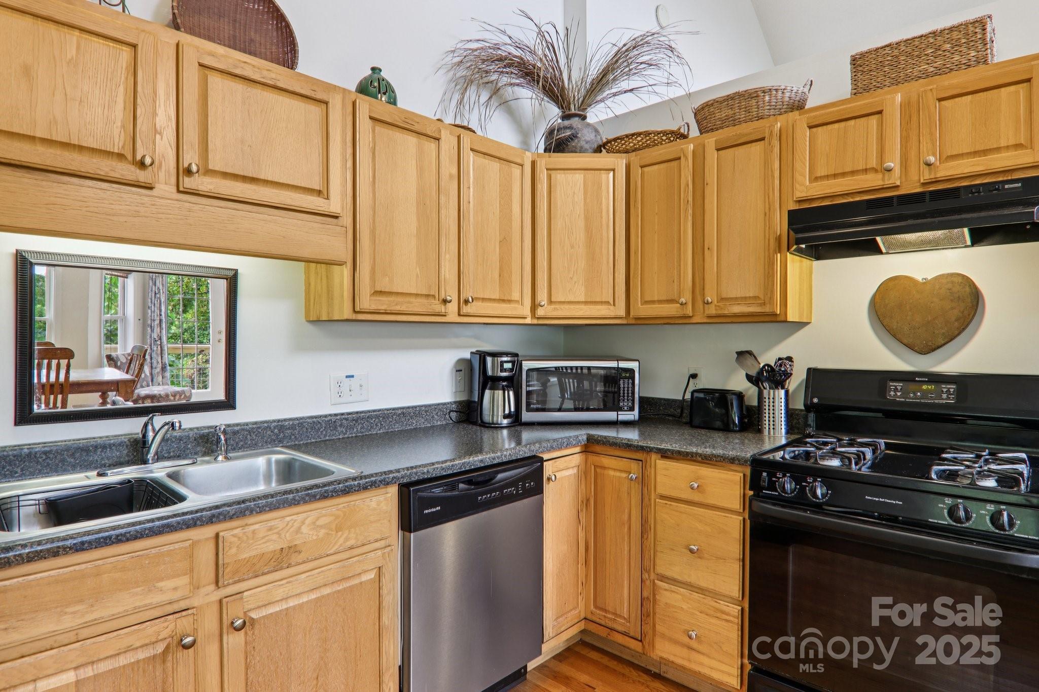 311 Jacks Knob Road Barnardsville, NC 28709 - Photo 30 of 48 a kitchen with stainless steel appliances granite countertop a stove a sink and a microwave