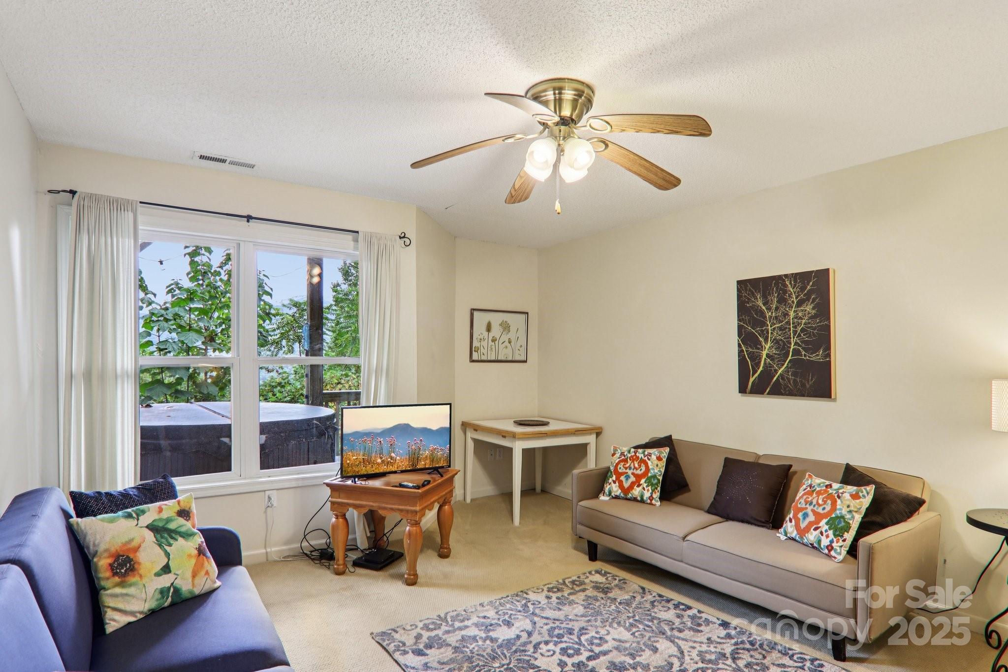 311 Jacks Knob Road Barnardsville, NC 28709 - Photo 35 of 48 a living room with furniture and a large window
