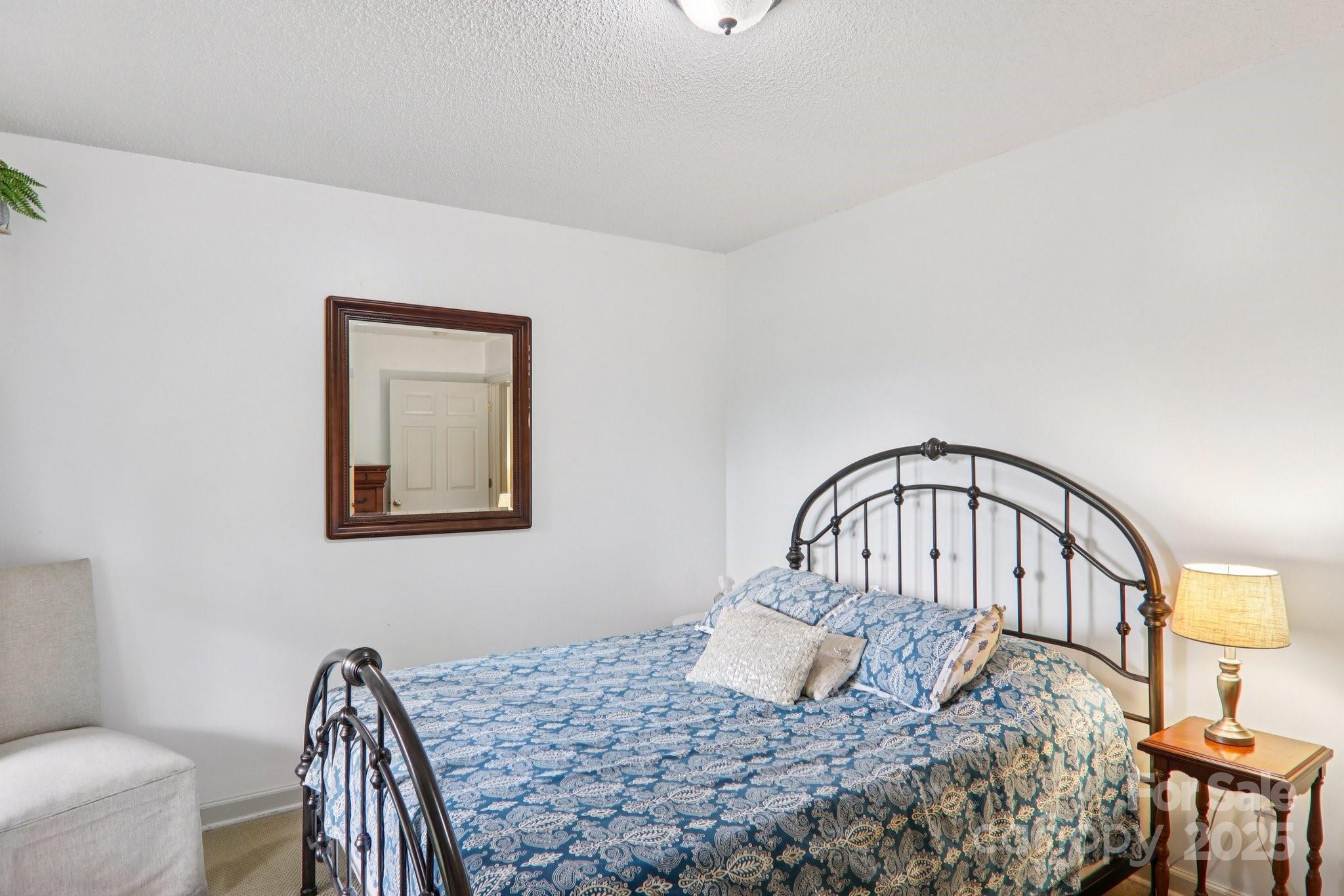 311 Jacks Knob Road Barnardsville, NC 28709 - Photo 38 of 48 a bedroom with a bed window and a table