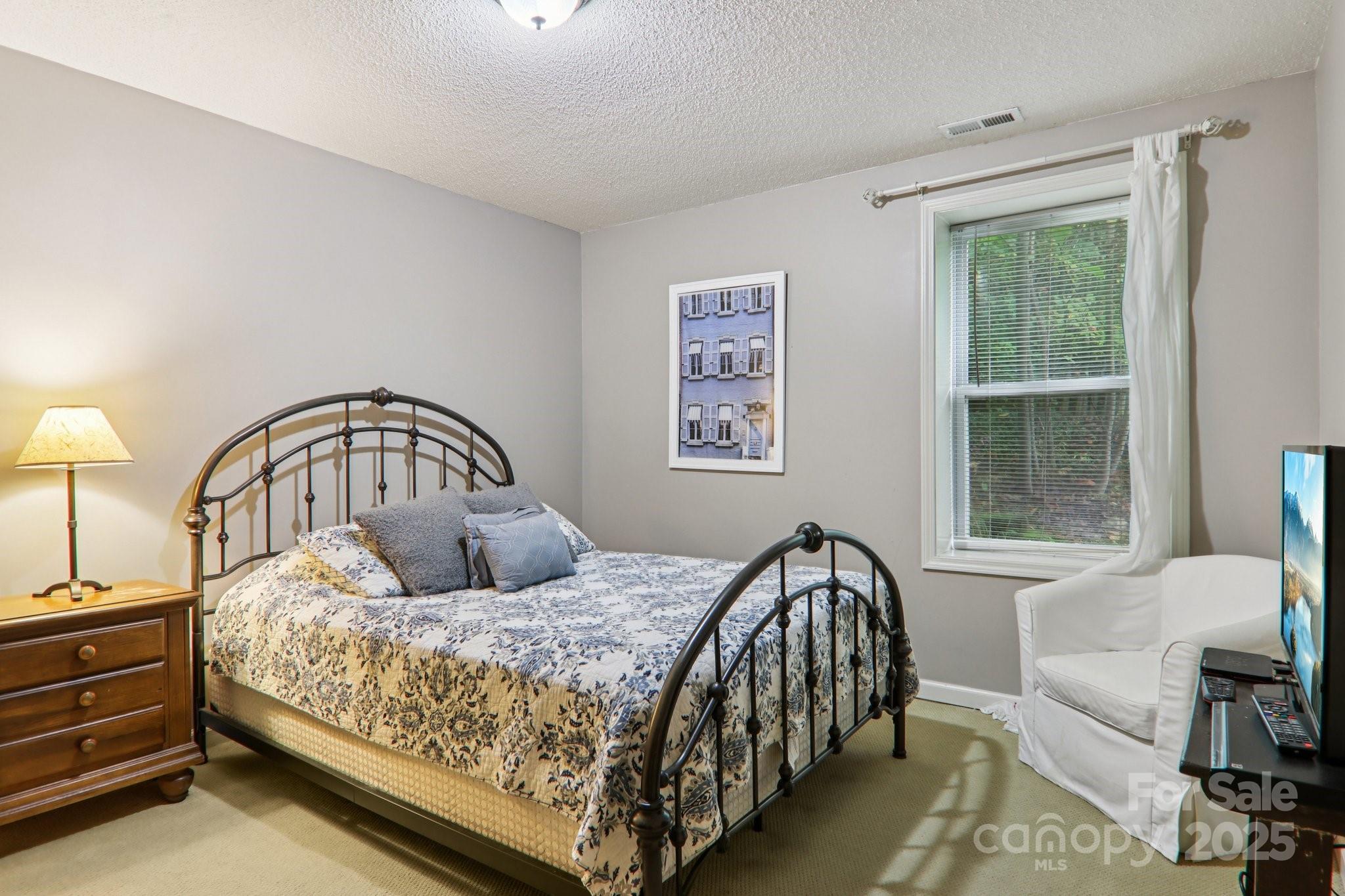 311 Jacks Knob Road Barnardsville, NC 28709 - Photo 41 of 48 a bedroom with a bed and a window