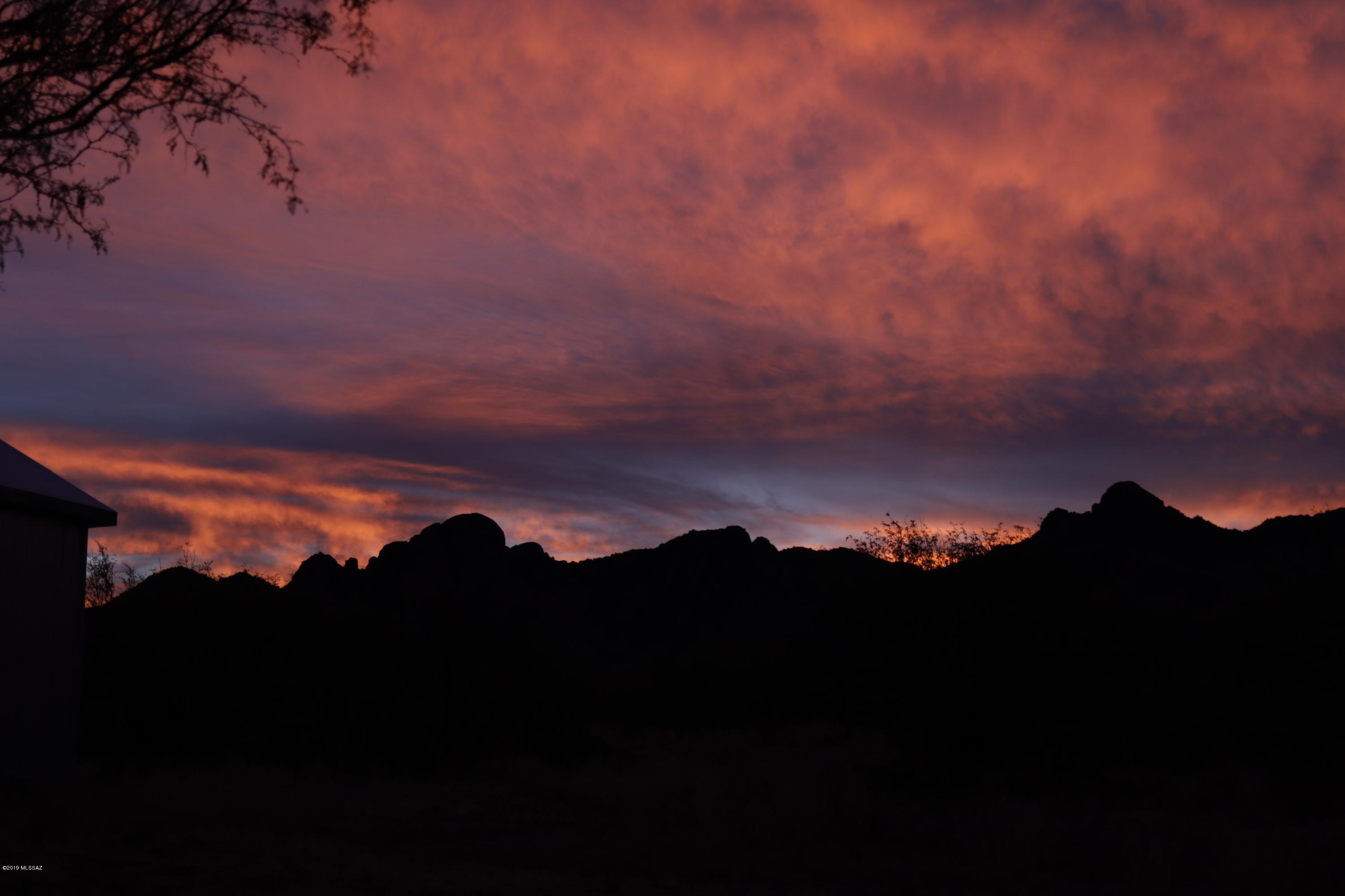 21960 South Helvetia Road Sahuarita, AZ 85629 - Photo 4 of 29 a view of sunset and a city
