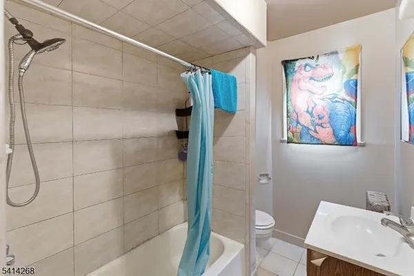 a bathroom with a shower and toilet
