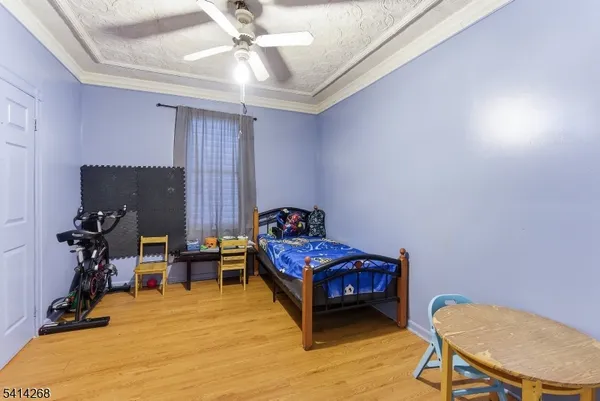 a living room with furniture and a chair