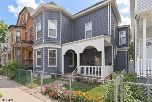 a front view of a house with a porch