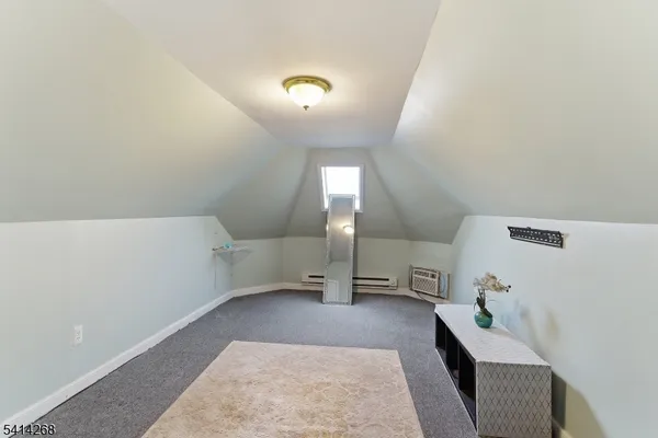 a bathroom with a toilet a sink and a window