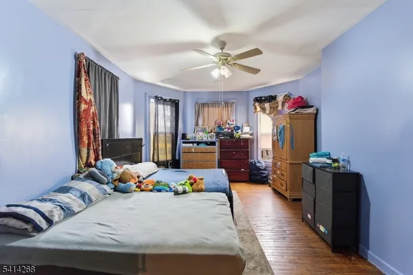a bedroom with furniture and a chandelier