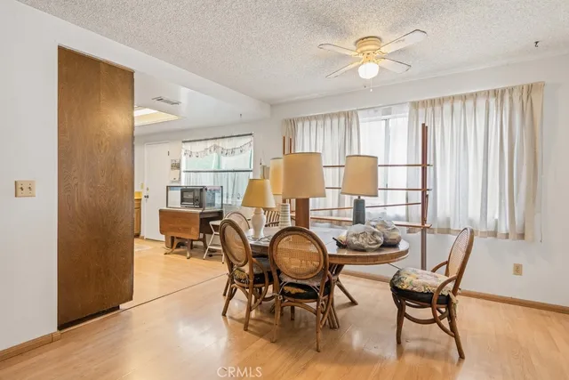 a dining room with furniture and window