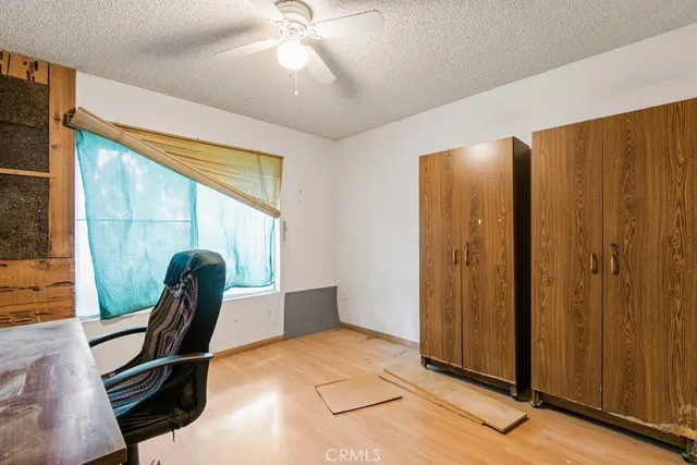 a view of a livingroom with furniture and windows