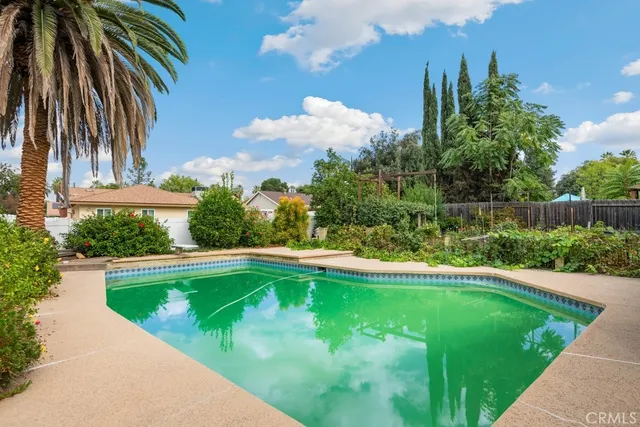 a view of a swimming pool with a garden