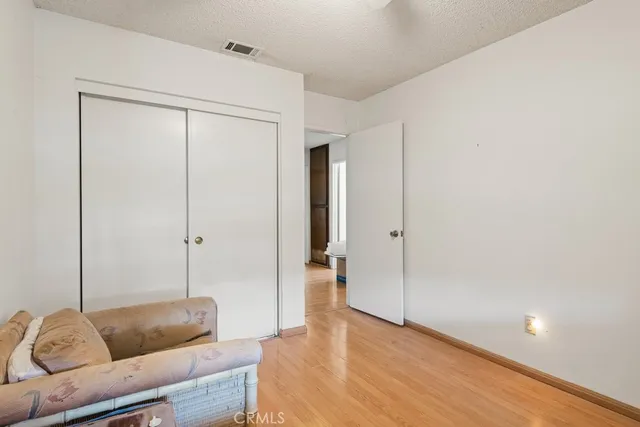 a living room with a couch and a shower