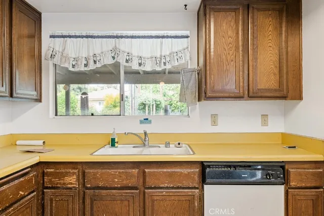 a kitchen with a sink and a window