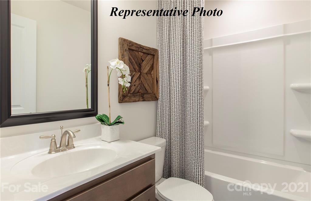 467 Hunters Dance Road, Unit 340 Fort Mill, SC 29708 - Photo 12 of 19 a bathroom with a sink a toilet and shower