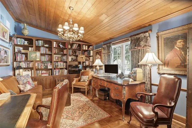 a view of a livingroom with furniture and a chandelier