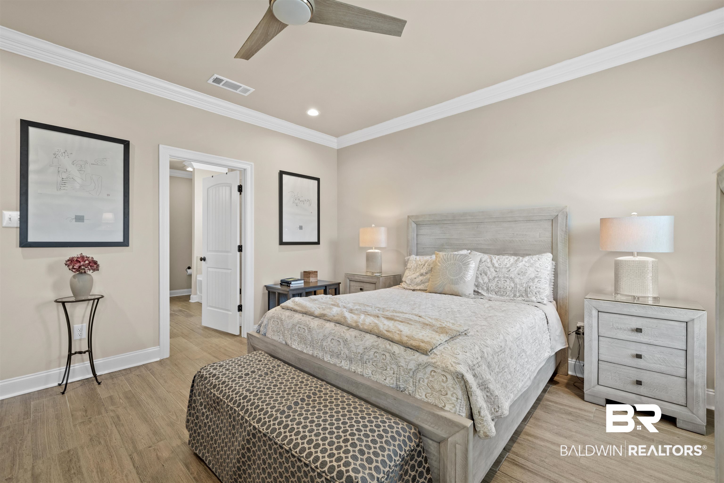 1509 Fenton Circle Foley, AL 36535 - Photo 22 of 34 Bedroom featuring light wood-style flooring, visible vents, crown molding, baseboards, and ceiling fan