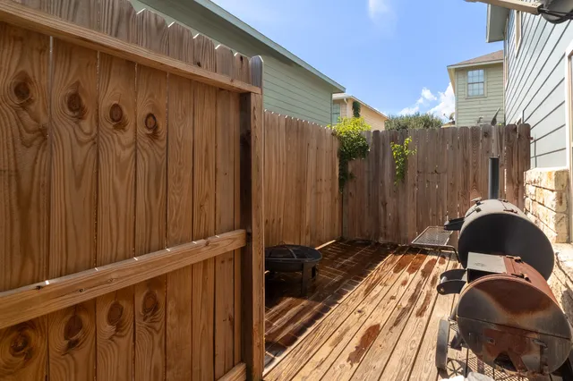 a view of a balcony with wooden floor