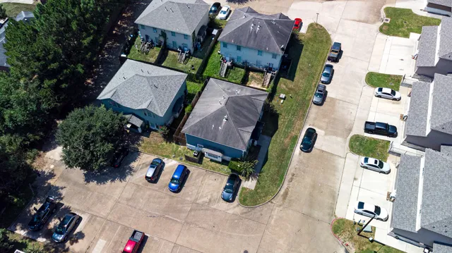 an aerial view of houses with outdoor space