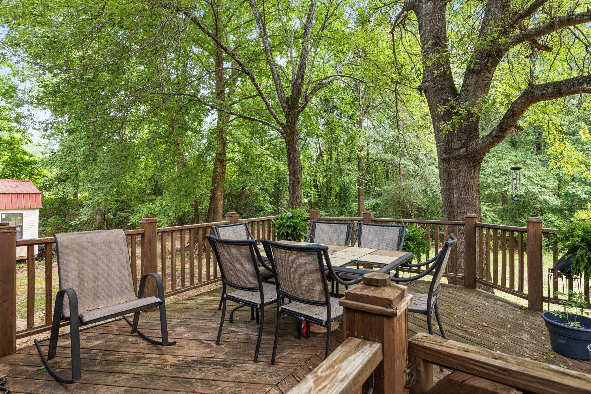 4625 Tucker Road Golden, MS 38847 - Photo 11 of 35 a view of a roof deck with table and chairs and wooden floor