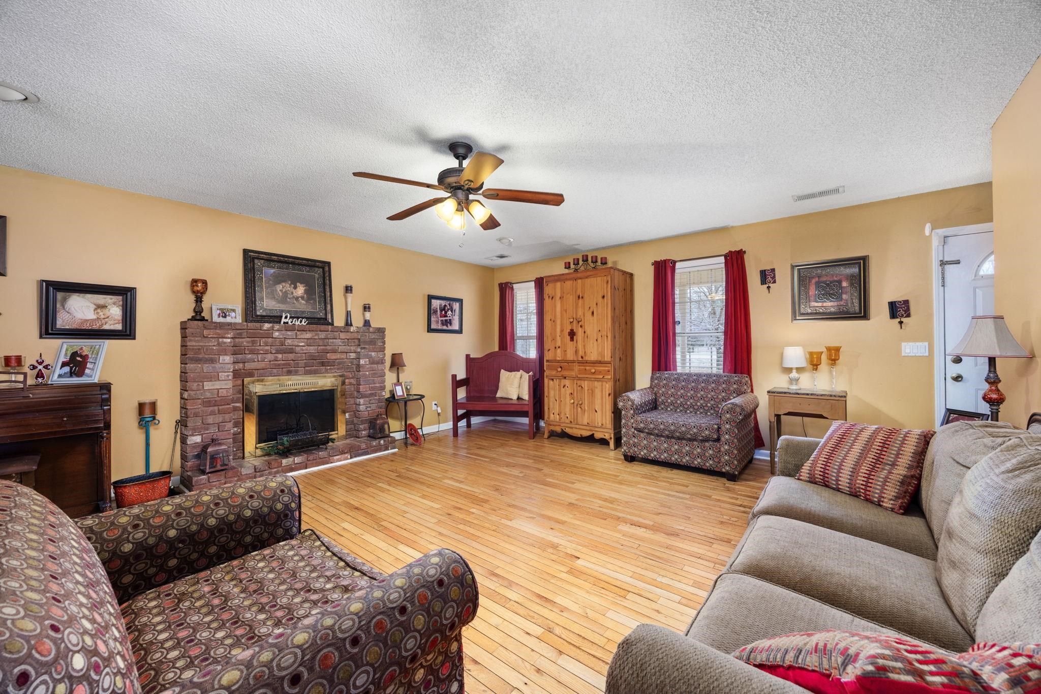 4625 Tucker Road Golden, MS 38847 - Photo 20 of 35 a living room with furniture and a fireplace