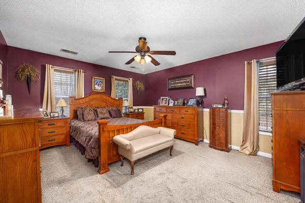 a bed room with furniture and a chandelier