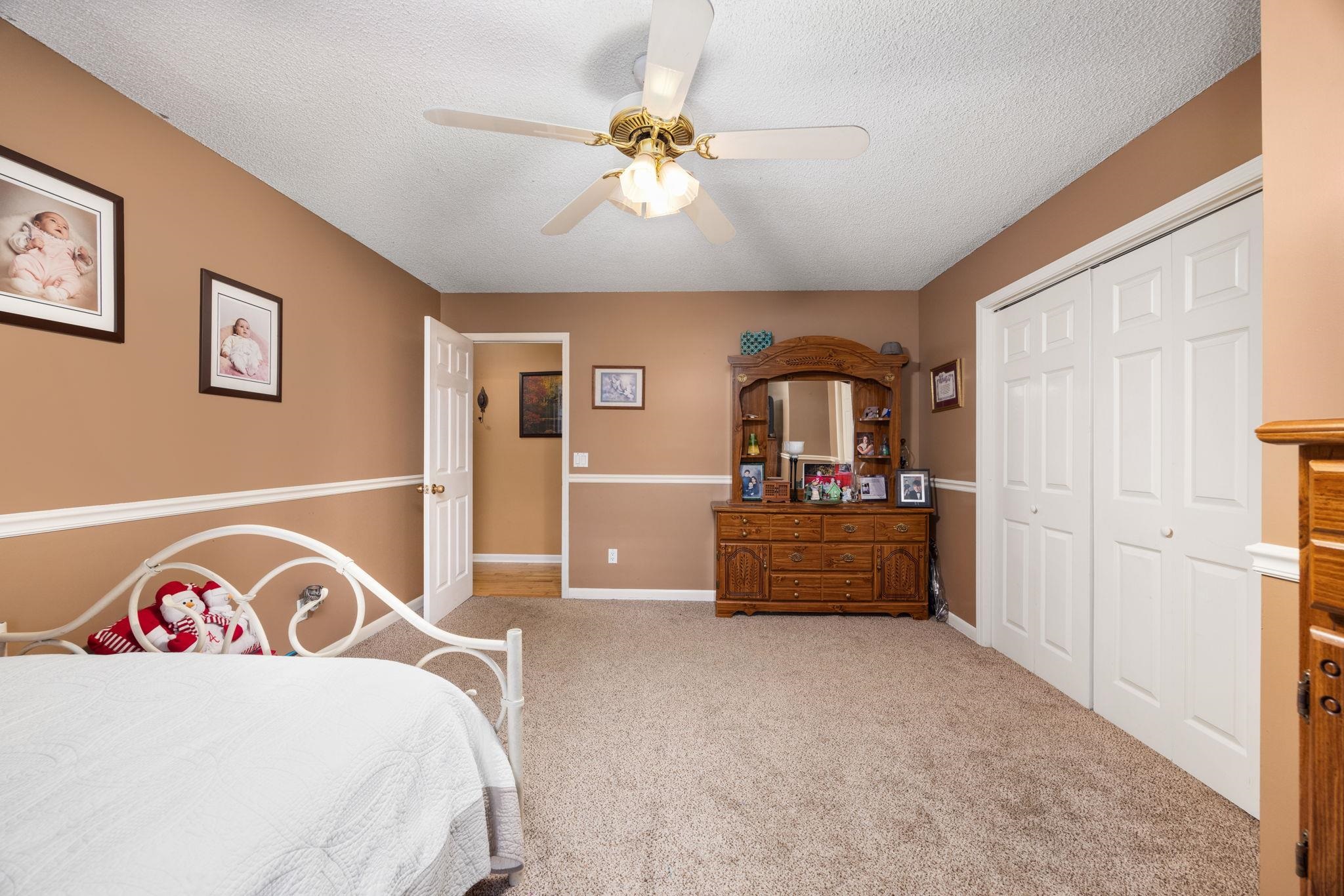 4625 Tucker Road Golden, MS 38847 - Photo 31 of 35 a bedroom with a bed and a chandelier