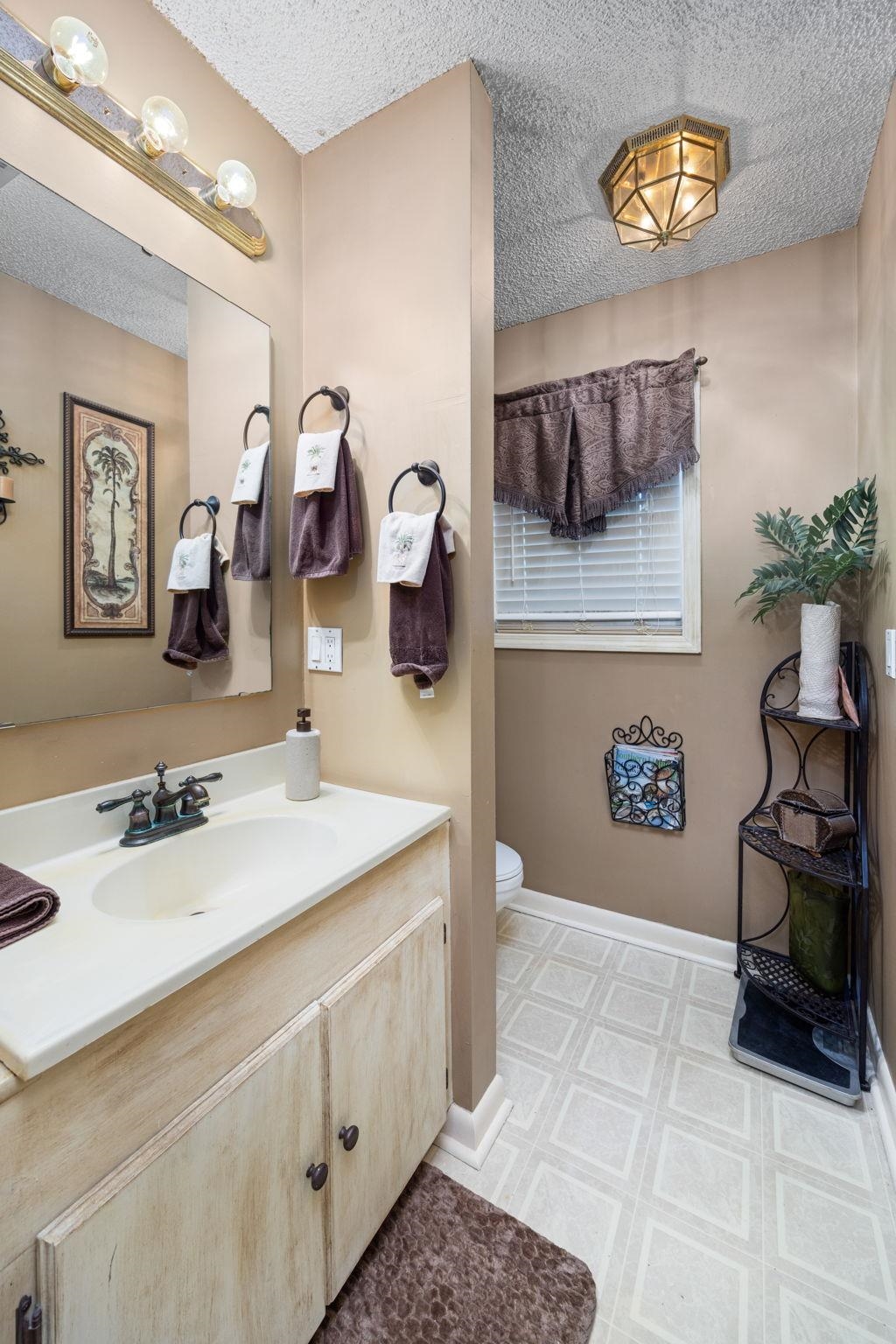 4625 Tucker Road Golden, MS 38847 - Photo 32 of 35 a bathroom with a sink and a mirror