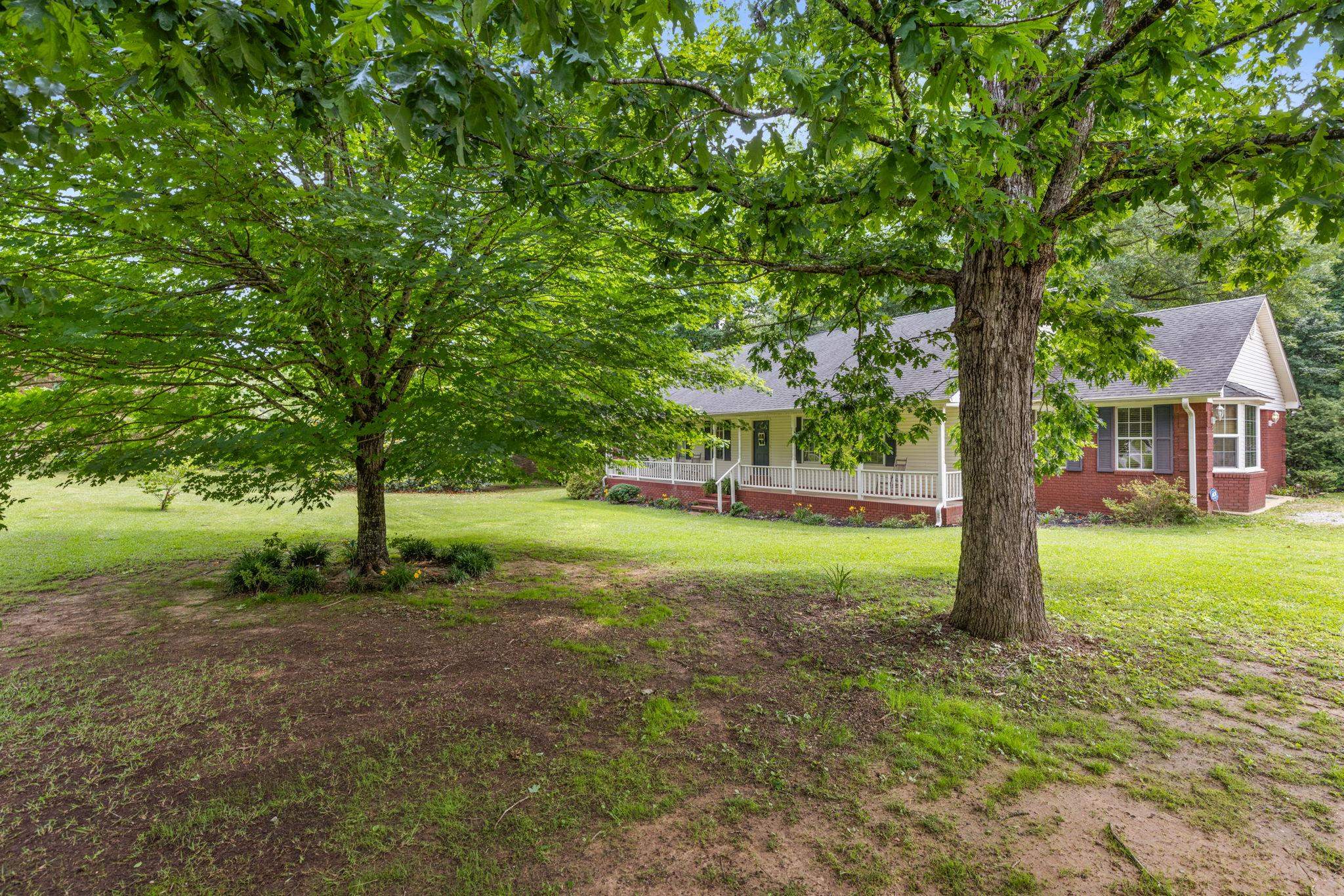 4625 Tucker Road Golden, MS 38847 - Photo 4 of 35 a view of a house with backyard and a tree
