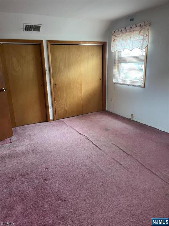 24 Stony Hill Road Clifton, NJ 07013 - Photo 12 of 17 an empty room with windows and closet