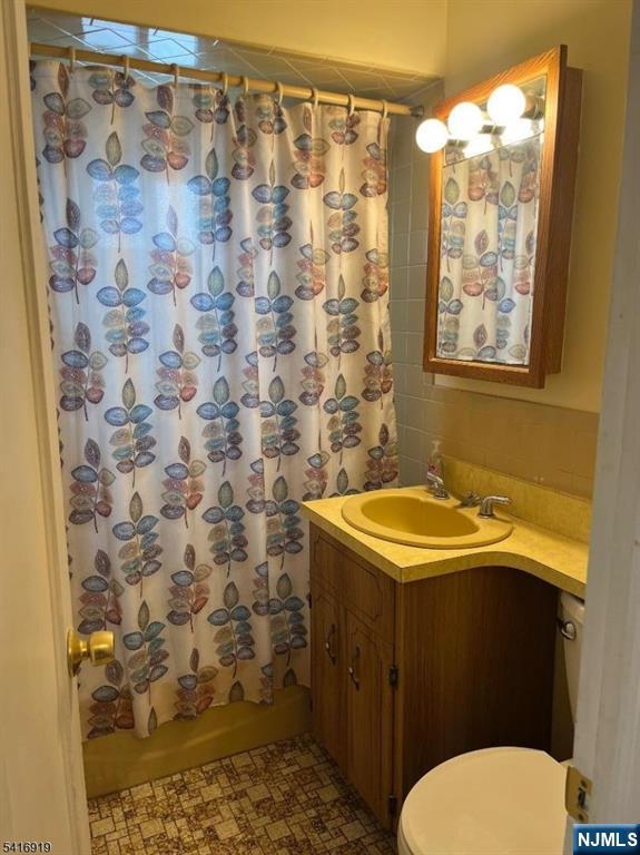 24 Stony Hill Road Clifton, NJ 07013 - Photo 13 of 17 a bathroom with a sink and a mirror