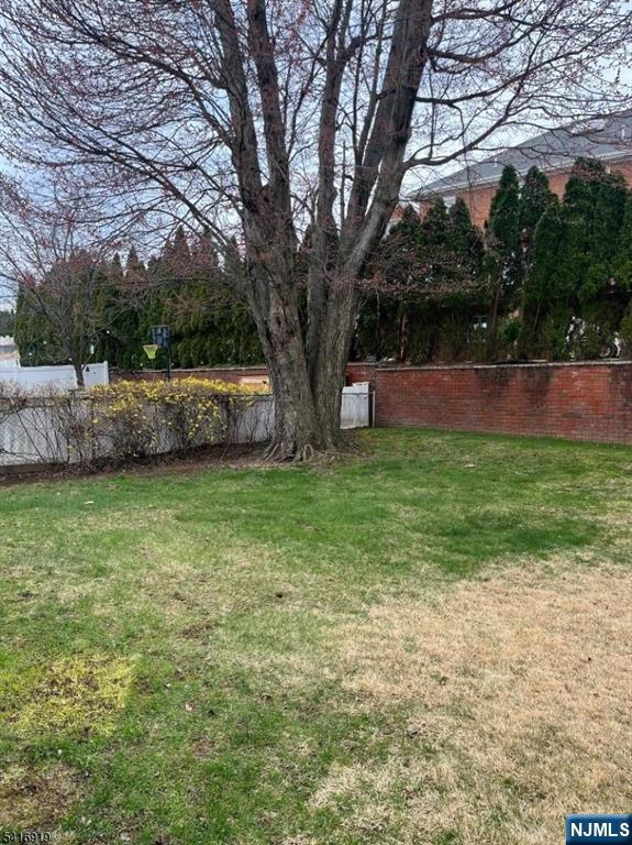 24 Stony Hill Road Clifton, NJ 07013 - Photo 15 of 17 a view of a backyard with large trees