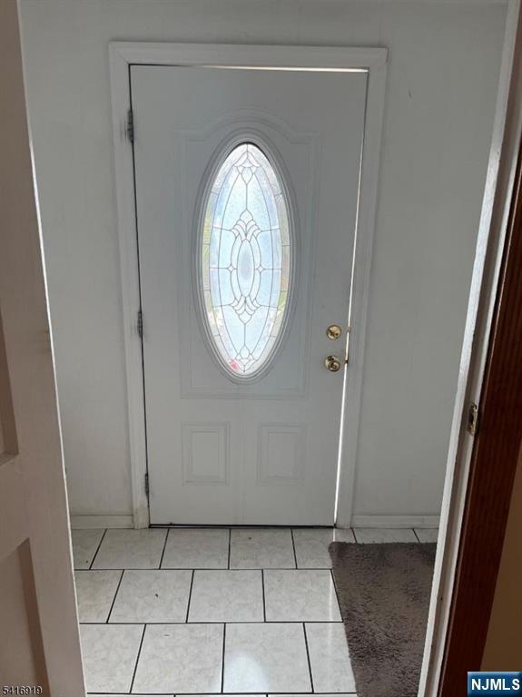 24 Stony Hill Road Clifton, NJ 07013 - Photo 2 of 17 a view of a livingroom with wooden floor and a window
