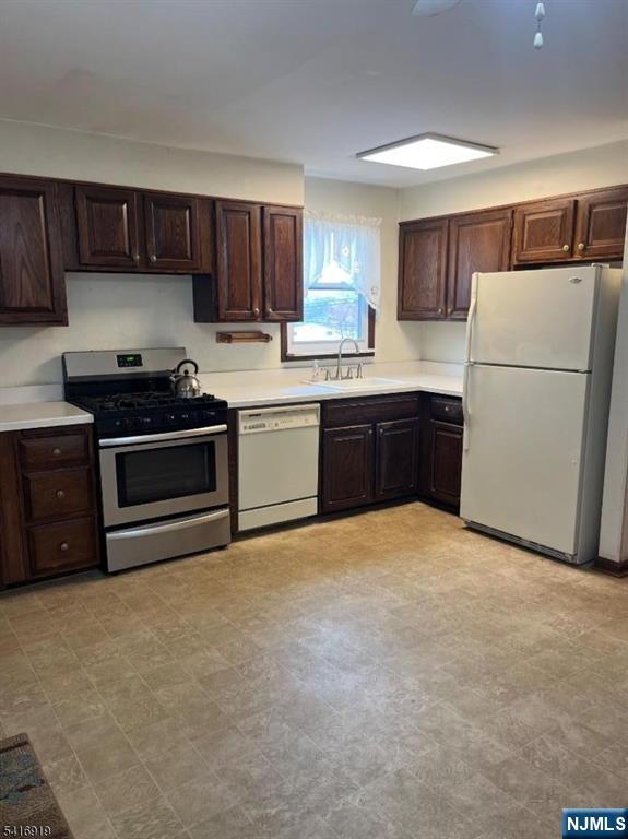 24 Stony Hill Road Clifton, NJ 07013 - Photo 5 of 17 a kitchen with stainless steel appliances granite countertop a refrigerator stove a sink and dishwasher