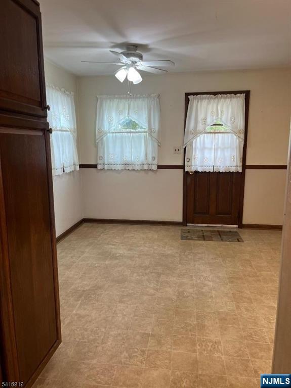 24 Stony Hill Road Clifton, NJ 07013 - Photo 6 of 17 an empty room with windows