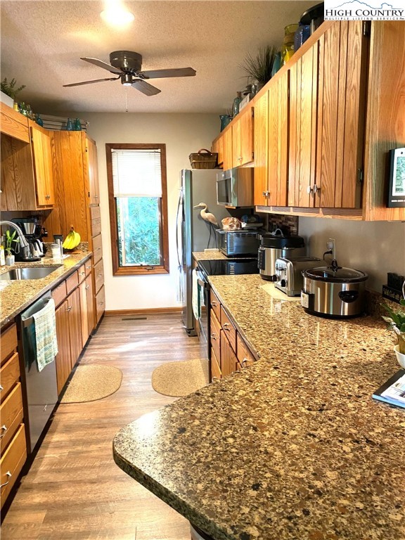 33 Goldfinch Road Newland, NC 28657 - Photo 11 of 29 a open kitchen with stainless steel appliances granite countertop a stove a sink and a microwave
