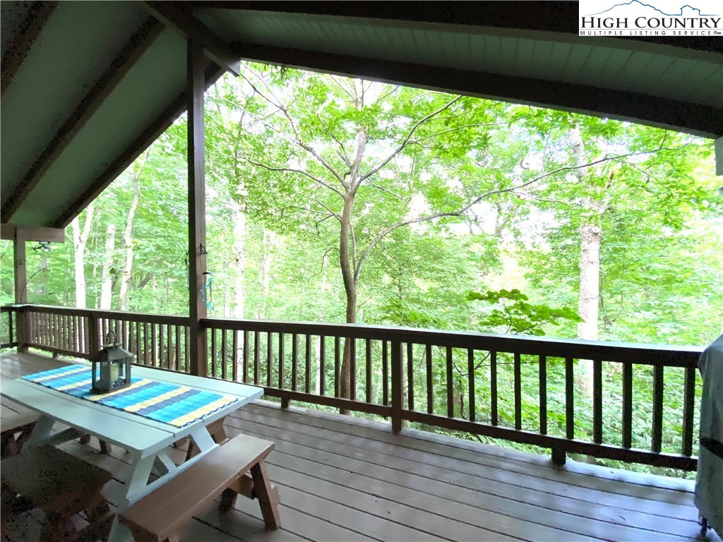 33 Goldfinch Road Newland, NC 28657 - Photo 5 of 29 a view of a balcony with furniture and wooden floor