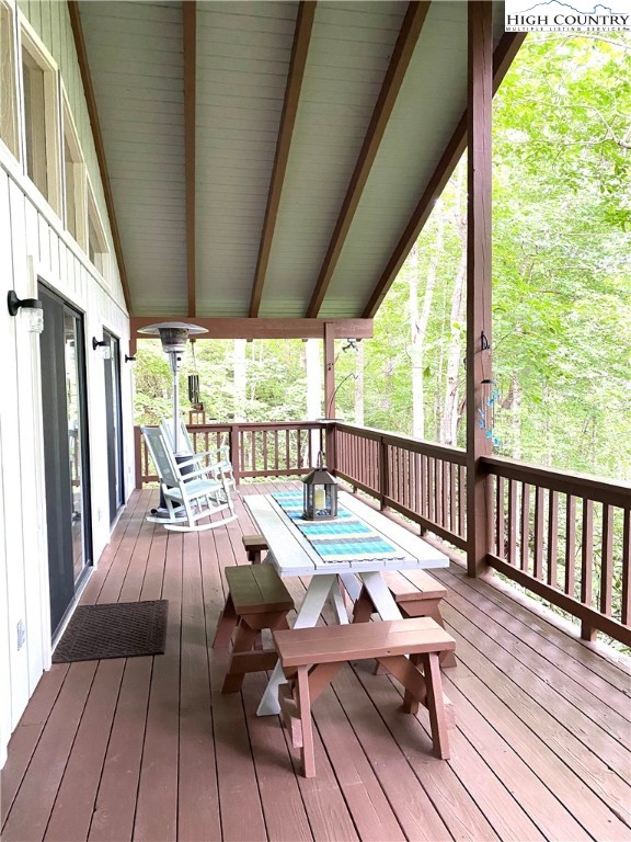 33 Goldfinch Road Newland, NC 28657 - Photo 7 of 29 a view of a patio with wooden floor chairs and table with wooden floor