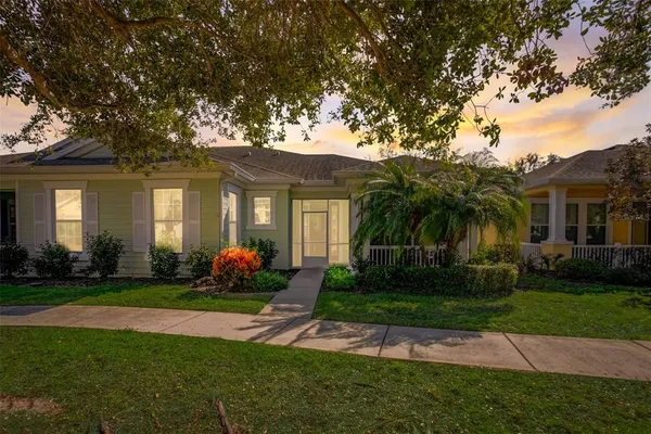 a front view of a house with garden and porch