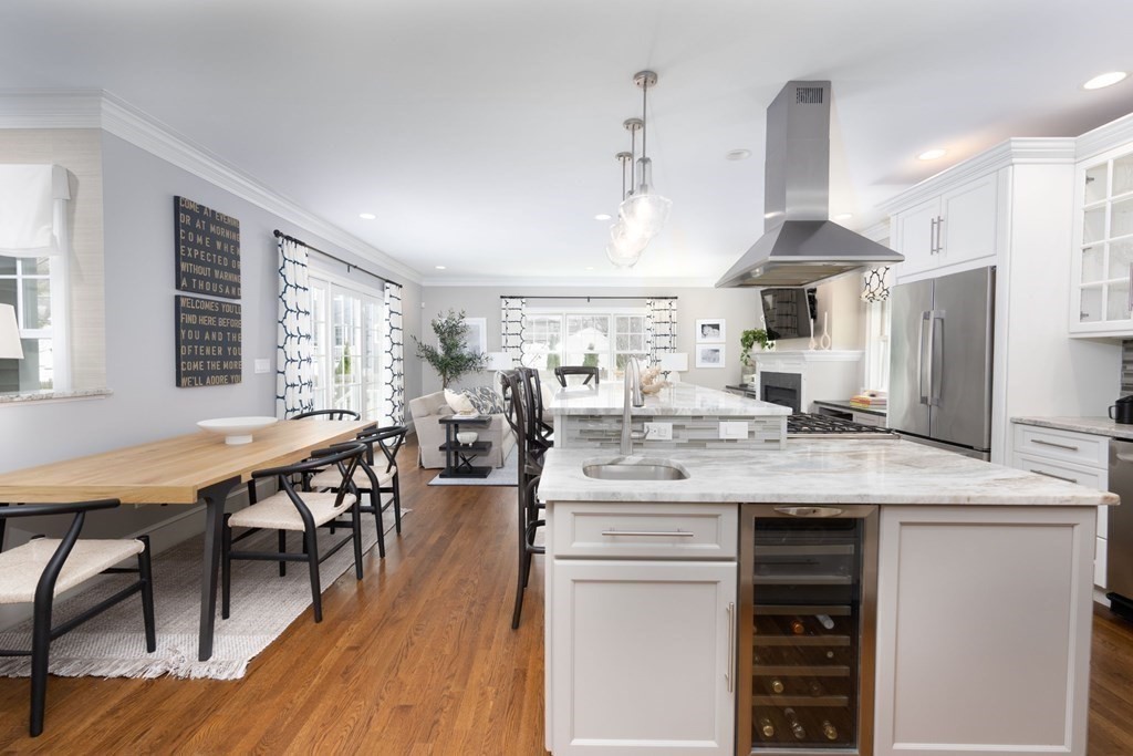 23 Sunset Road Winchester, MA 01890 - Photo 5 of 25 a large kitchen with a table and chairs