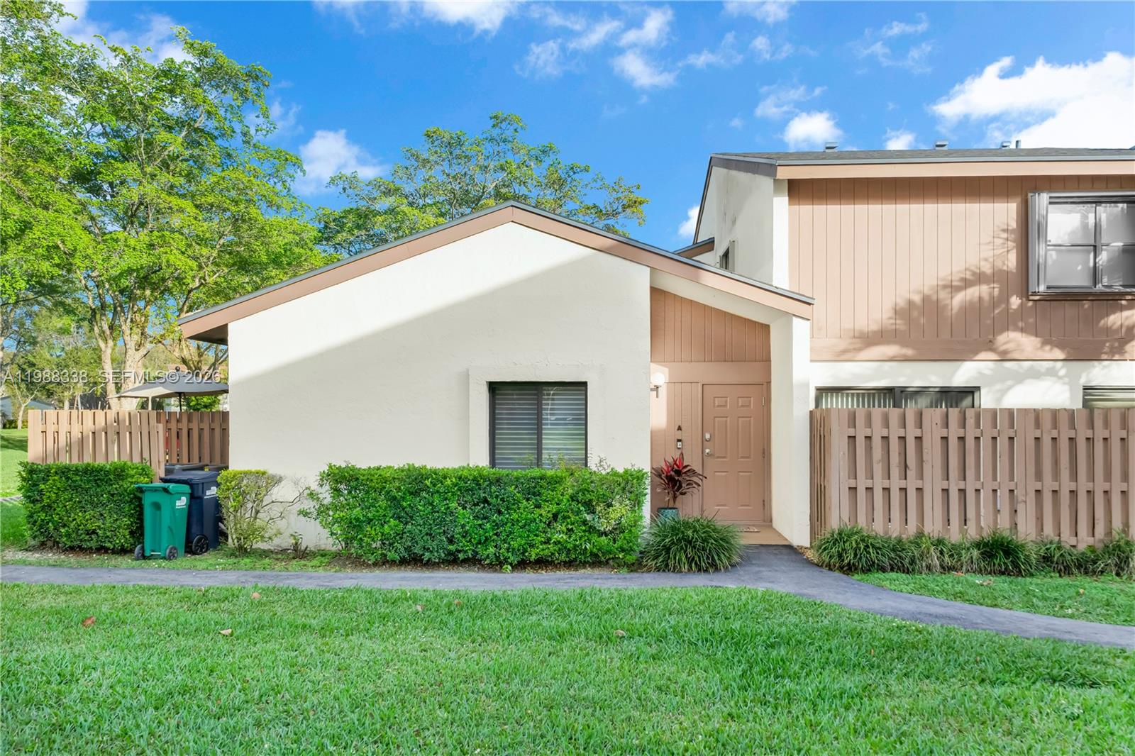 a view of backyard with a garden and plants