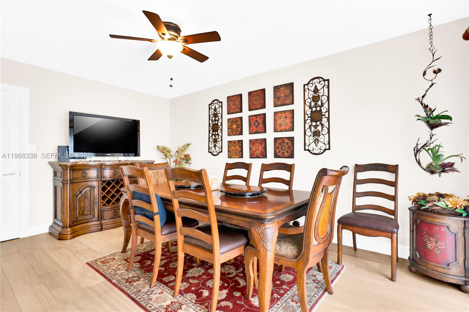 10909 Southwest 113th Place, Unit 68A Miami, FL 33176 - Photo 13 of 37 a view of a dining room with furniture and wooden floor