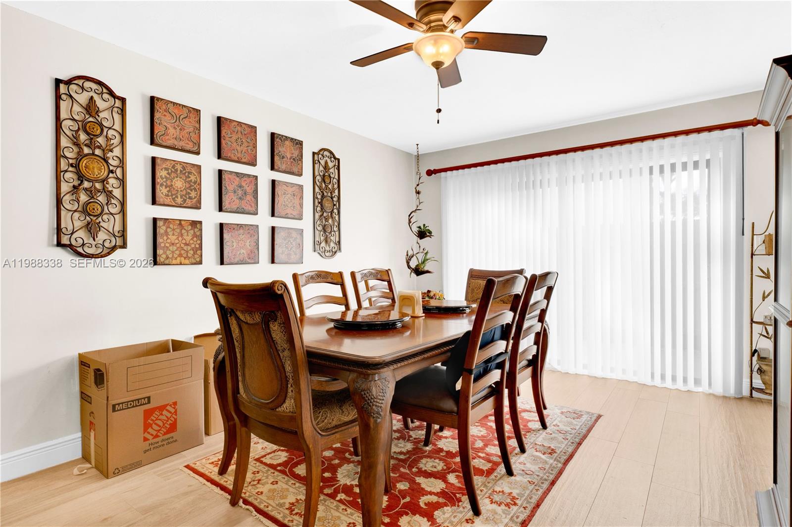 10909 Southwest 113th Place, Unit 68A Miami, FL 33176 - Photo 15 of 37 a view of a dining room with furniture and window