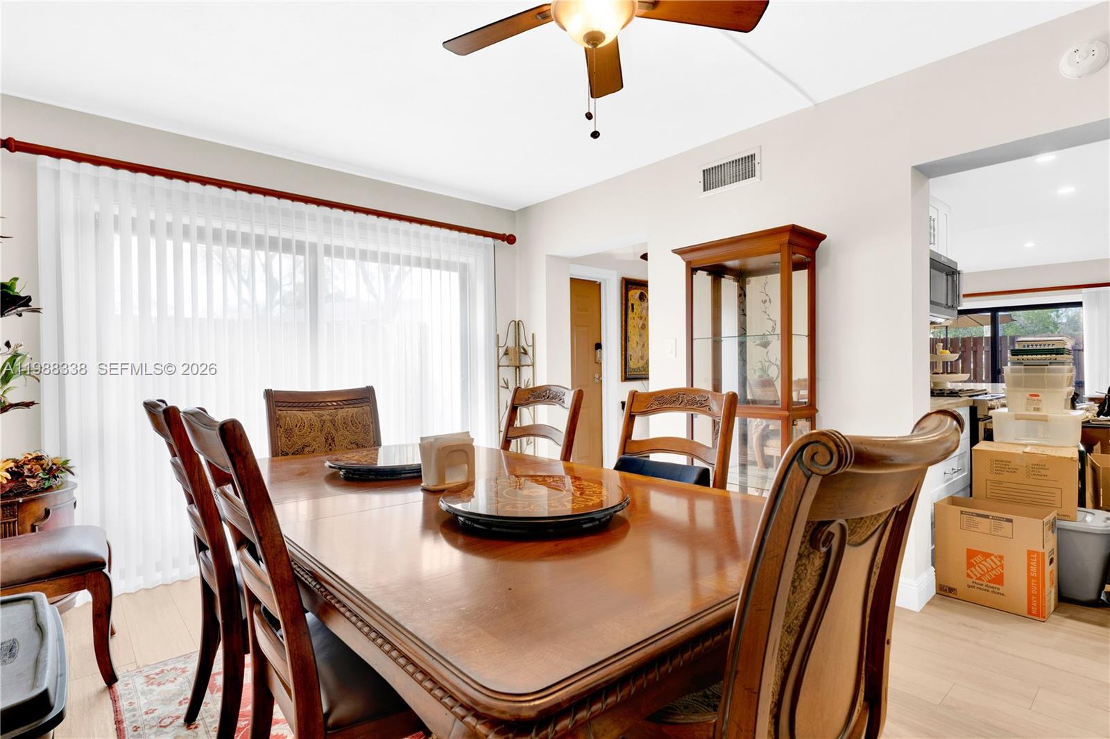 10909 Southwest 113th Place, Unit 68A Miami, FL 33176 - Photo 16 of 37 a view of a dining room with furniture