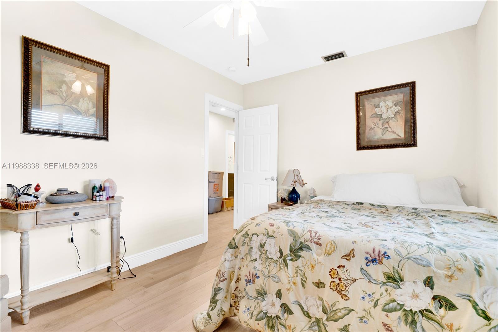 10909 Southwest 113th Place, Unit 68A Miami, FL 33176 - Photo 22 of 37 a bedroom with a bed and a cabinets