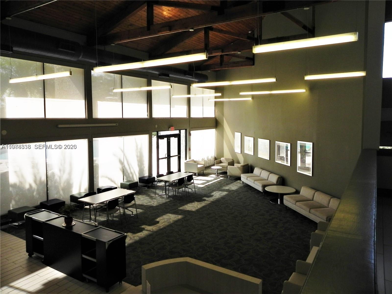 10909 Southwest 113th Place, Unit 68A Miami, FL 33176 - Photo 32 of 37 a living room with hard wood flooring and furniture