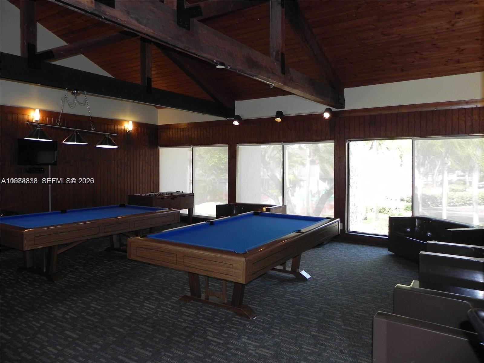 10909 Southwest 113th Place, Unit 68A Miami, FL 33176 - Photo 33 of 37 a room with pool table and windows