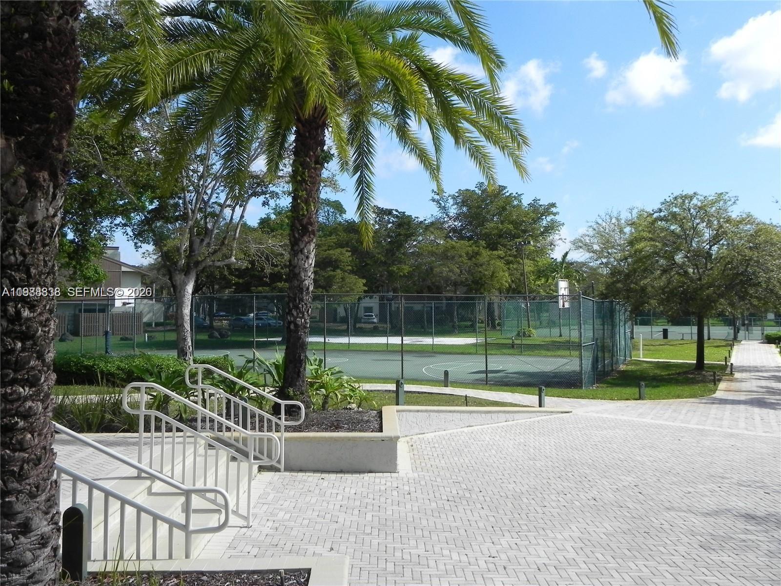 10909 Southwest 113th Place, Unit 68A Miami, FL 33176 - Photo 34 of 37 a view of a park with large trees