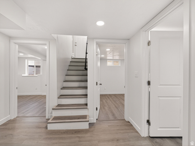 74 South 300 East Springville, UT 84663 - Photo 19 of 48 Finished lower level featuring a modern staircase with wood-finish treads and risers, recessed lighting, and light wood-finish flooring