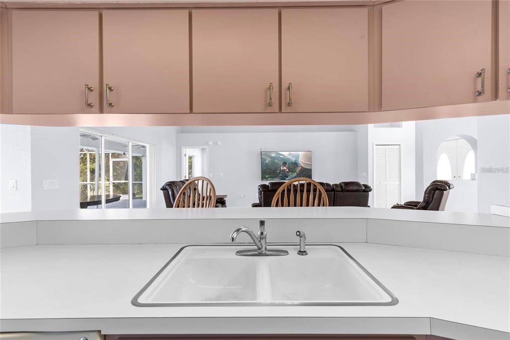 10446 Baylor Drive Spring Hill, FL 34608 - Photo 11 of 32 a kitchen with a sink and cabinets